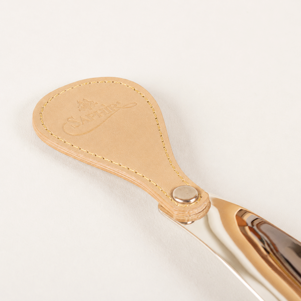 Saphir Médaille d'Or schoenlepel leer met metaal