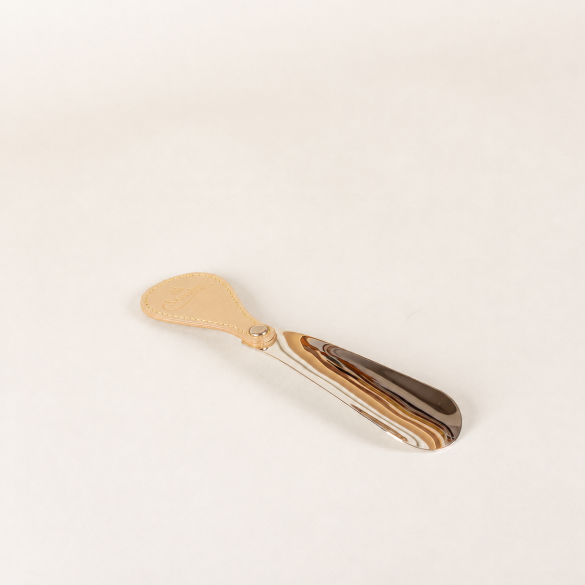 Saphir Médaille d'Or schoenlepel leer met metaal